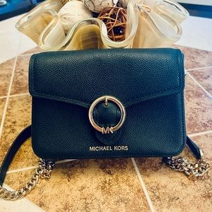 Michael Kors medium leather crossbody in navy and gold, round logo.